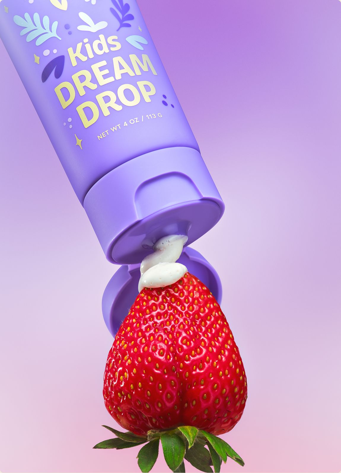 DAYLY DREAM DROP tube with a strawberry on the cap
