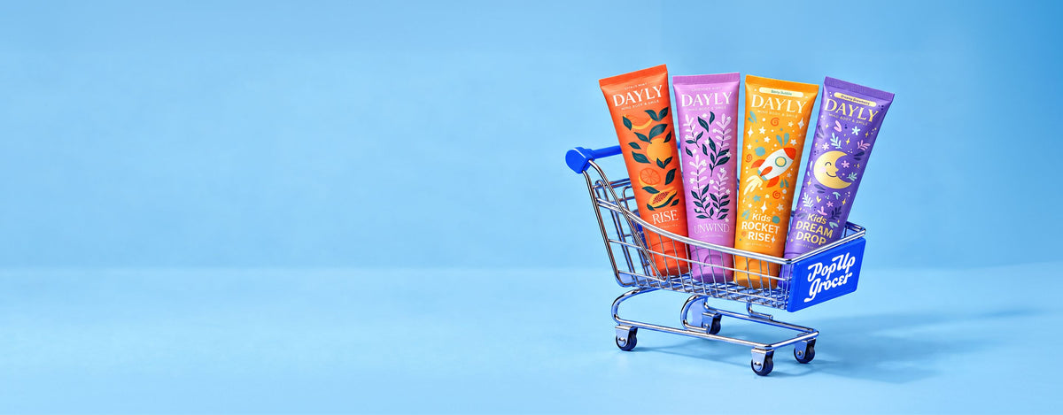 DAYLY toothpaste tubes in a Pop Up Grocer shopping cart in New York City