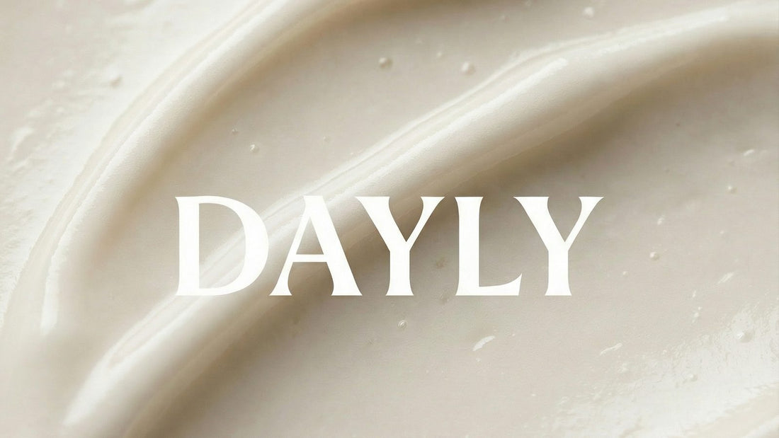 Close-up of DAYLY toothpaste texture with the DAYLY logo