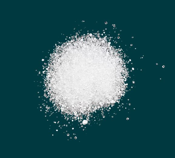 Pile of white magnesium citrate crystals