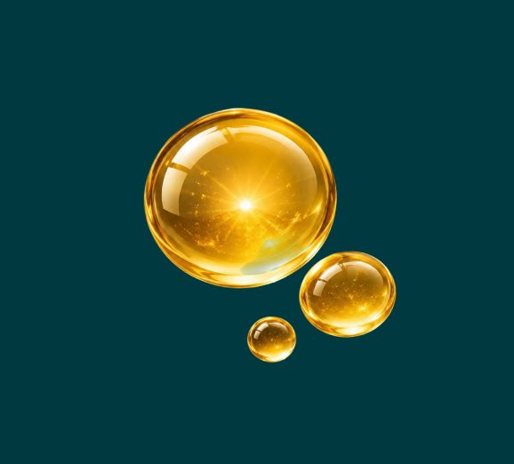 Golden droplets representing vitamin D3